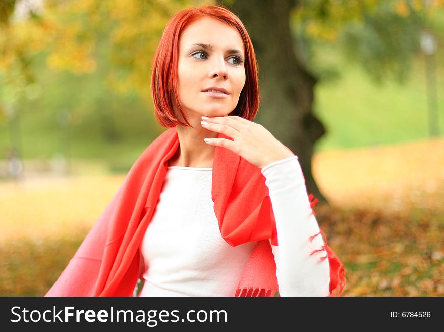 Young girl relaxing in autumn park