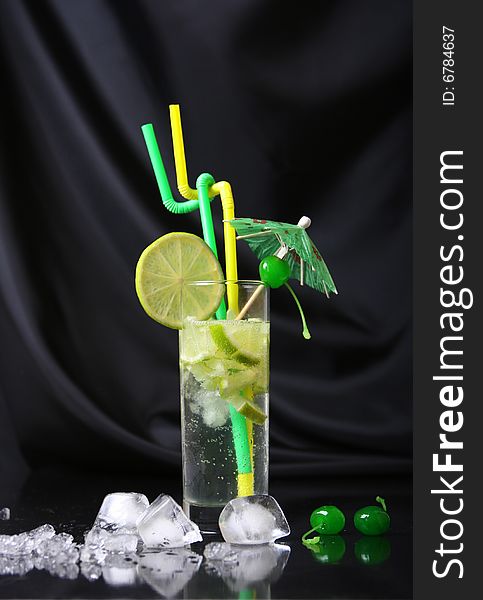 Fresh green cocktail on black background
