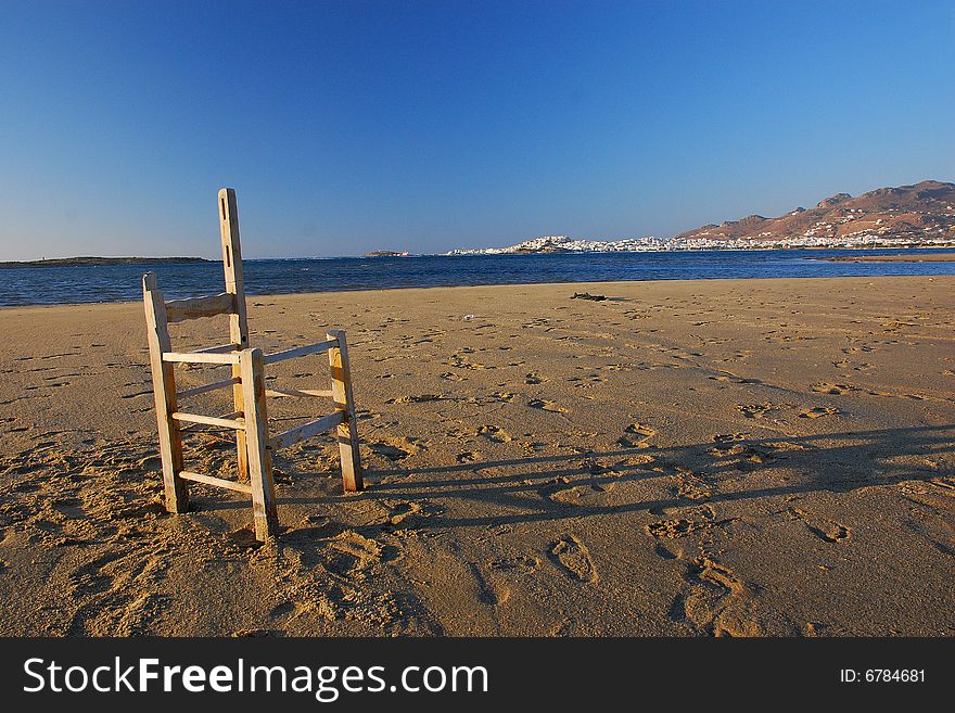 Old chair...abandoned in a desert beach. Old chair...abandoned in a desert beach..