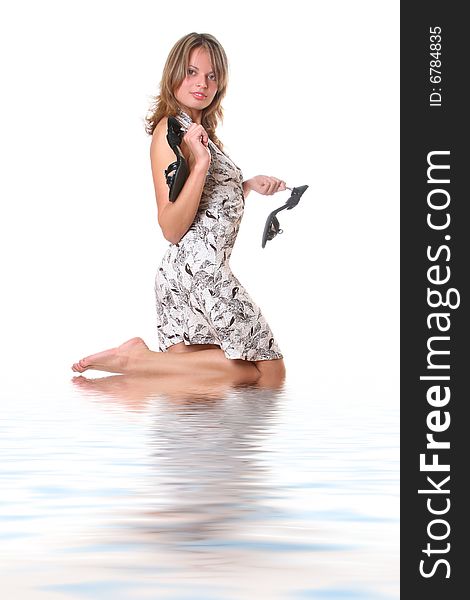 Beautiful young barefooted girl in water. Beautiful young barefooted girl in water