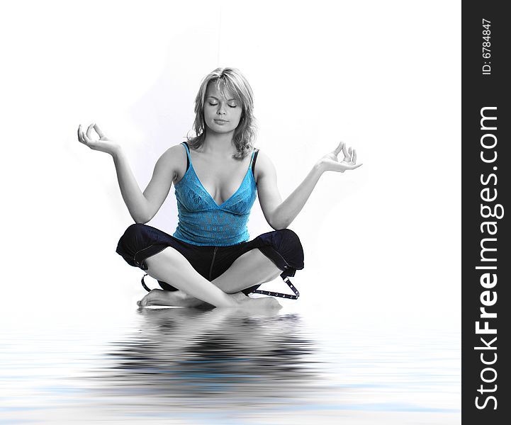 Young girl meditating in water. Young girl meditating in water