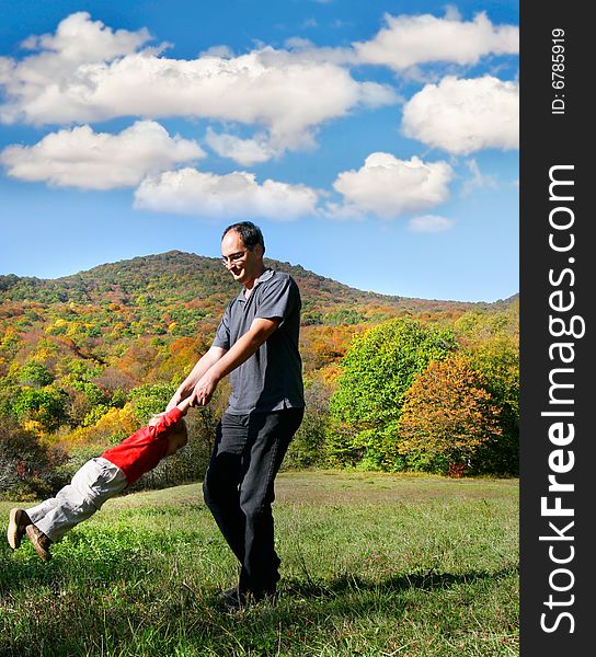 Father playing with son outdoor