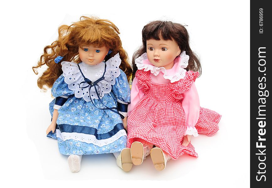 Shot of two vintage dolls on white