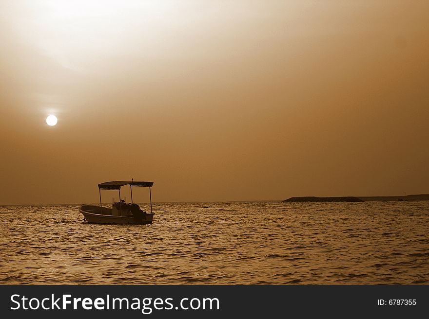 Jumeira Beach at Sunset with sailing boat. Jumeira Beach at Sunset with sailing boat