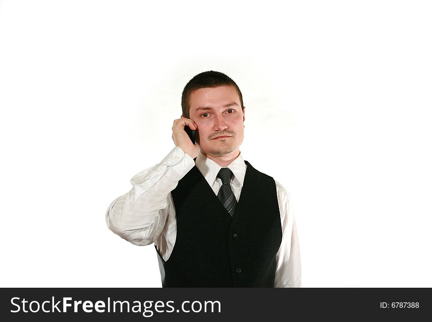 Young man in vest with mobile phone on white. Young man in vest with mobile phone on white