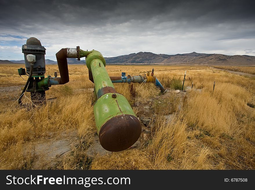 Abandoned irrigation pipes, in field of dried up vegetation. Abandoned irrigation pipes, in field of dried up vegetation