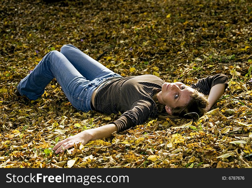 Young Woman In Autumn Forest