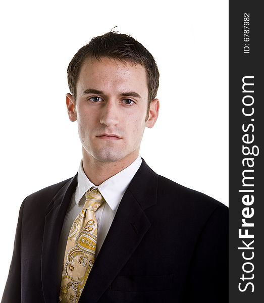 A serious looking young businessman on white. A serious looking young businessman on white