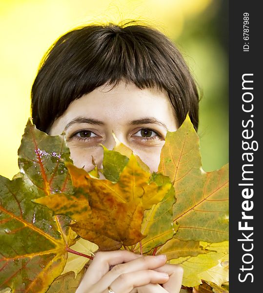 Young Woman With Maple Leaves