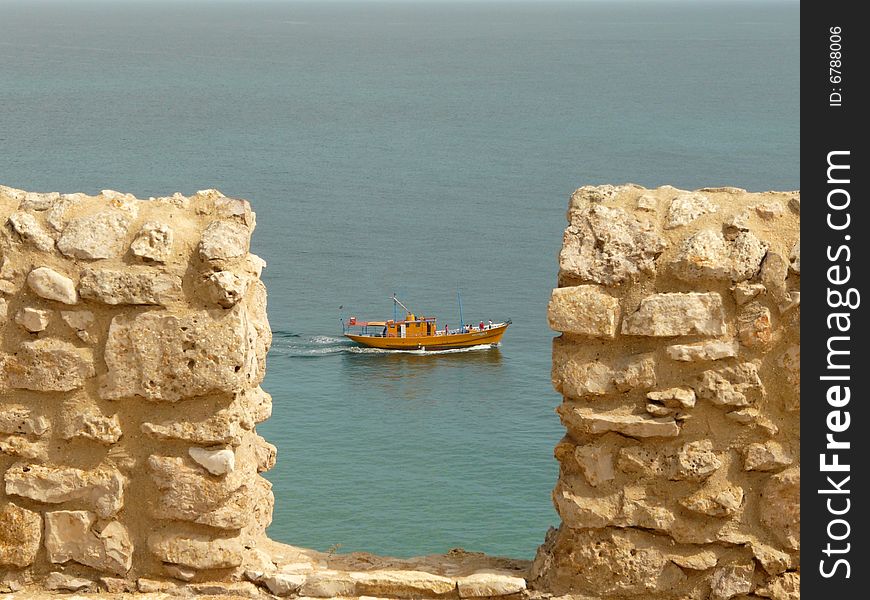 Boat from the bastions of Sagres fortress, Algarve. Boat from the bastions of Sagres fortress, Algarve