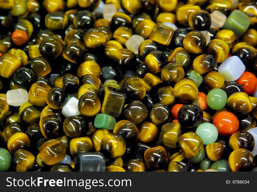 Natural background - pile of polished semi precious jewelery stones closeup. best for craftmanship, interior design, gift (soft focus). Natural background - pile of polished semi precious jewelery stones closeup. best for craftmanship, interior design, gift (soft focus)