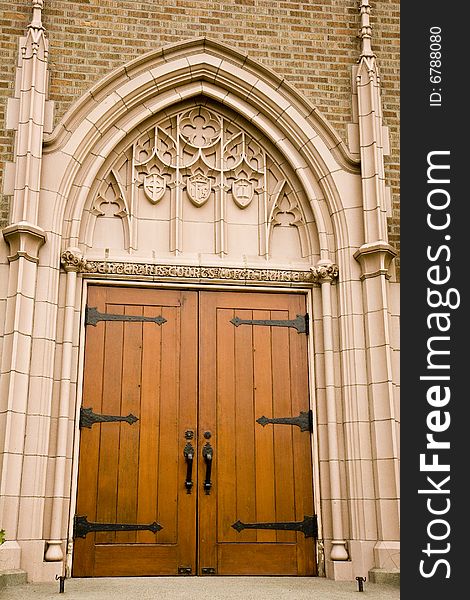 An old wooden church door with iron hinges and handles. An old wooden church door with iron hinges and handles