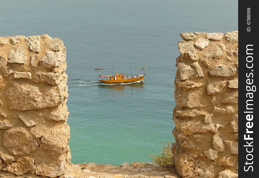 Boat seen from the bastions of Sagres fortress, Algarve. Boat seen from the bastions of Sagres fortress, Algarve