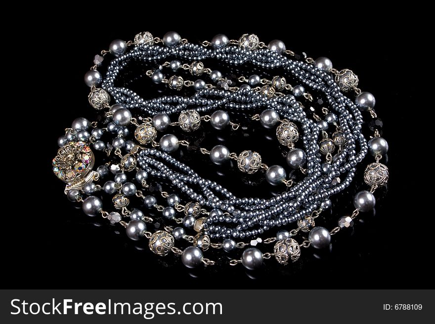 Silver imitation jewelry on black