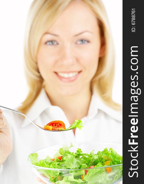 The blonde holds a plug with salad isolated. The blonde holds a plug with salad isolated