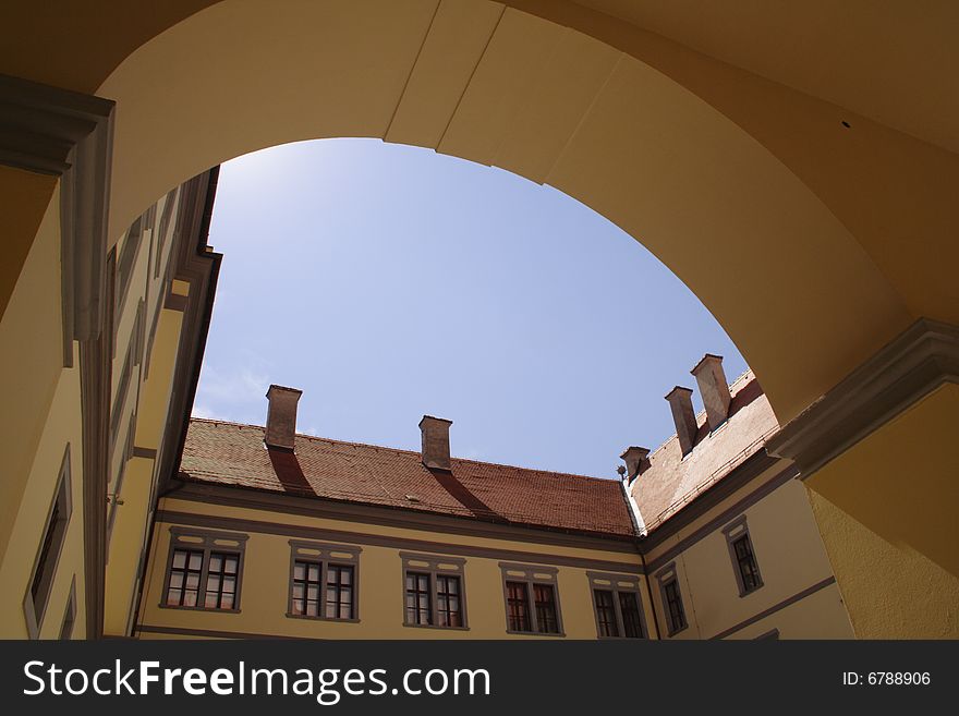 The yard of a castle with blue sky