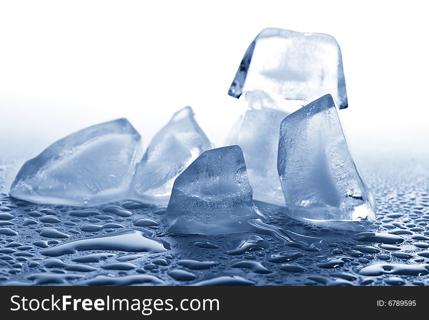 Melting ice cubes toned blue