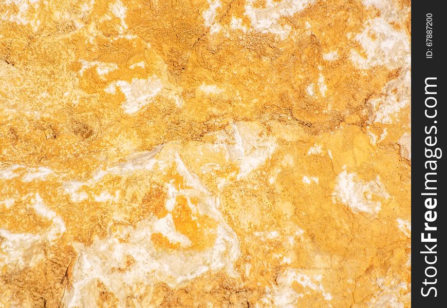 Background with orange colored textured water rock for web design