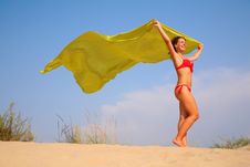 Young Girl On Sand With Yellow Shawl In Hands Stock Photography Young Girl On Sand With Yellow Shawl In Hands Stock Photography
