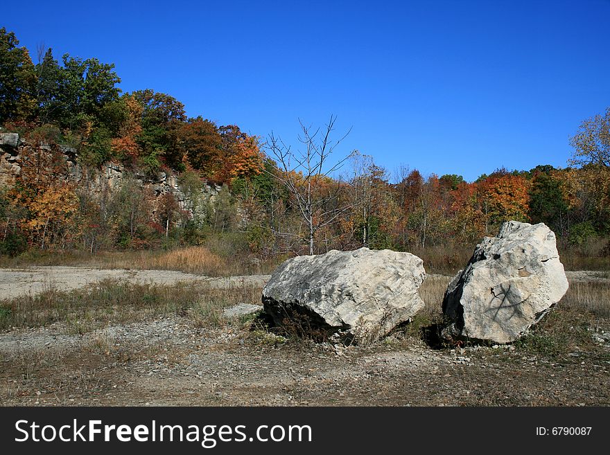 Autumn in the forest with two big rocks. Autumn in the forest with two big rocks