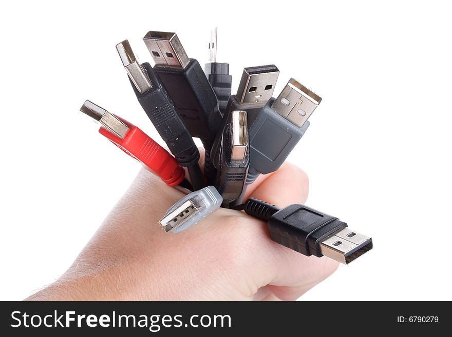 Many usb cables in hand, isolated on white