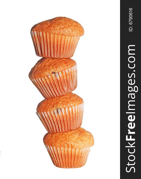 Heap of four muffins isolated on white