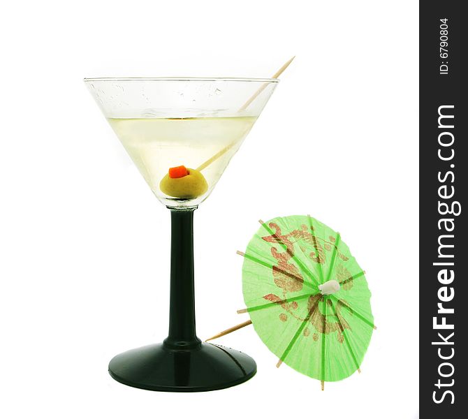 Cocktail with olive and umbrella