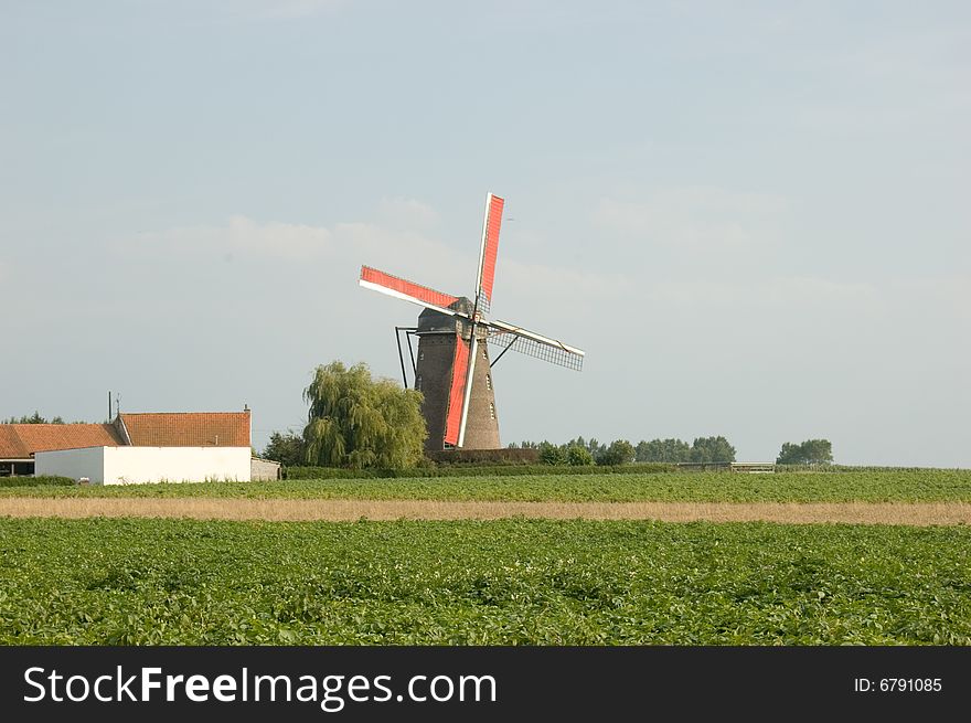 This windmill was standing on the outskirts of a town near the French Belgium boarder. The sails were red and reminded me of a famous belgium beer brand. This windmill was standing on the outskirts of a town near the French Belgium boarder. The sails were red and reminded me of a famous belgium beer brand.