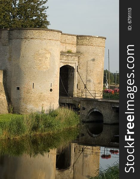 This is a picture of the entrance to a fortified town in Northern France. The Town is surrounded by a moat and has a series of gates simiar to this one. This is a picture of the entrance to a fortified town in Northern France. The Town is surrounded by a moat and has a series of gates simiar to this one