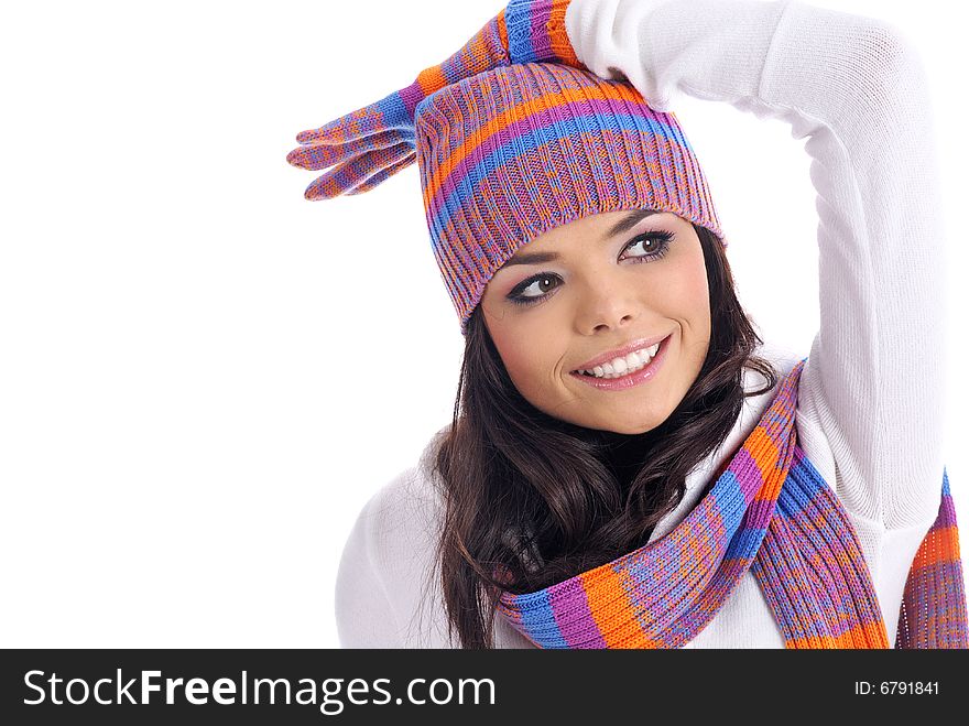 Sexual girl in a multicolor hat and gloves. Winter fashion. Sexual girl in a multicolor hat and gloves. Winter fashion.