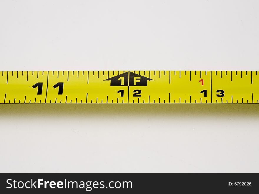 A measuring tape with isolated two inch segment. A measuring tape with isolated two inch segment