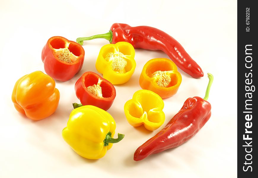 Composition of red,yellow and orange peppers with two chilies. Composition of red,yellow and orange peppers with two chilies