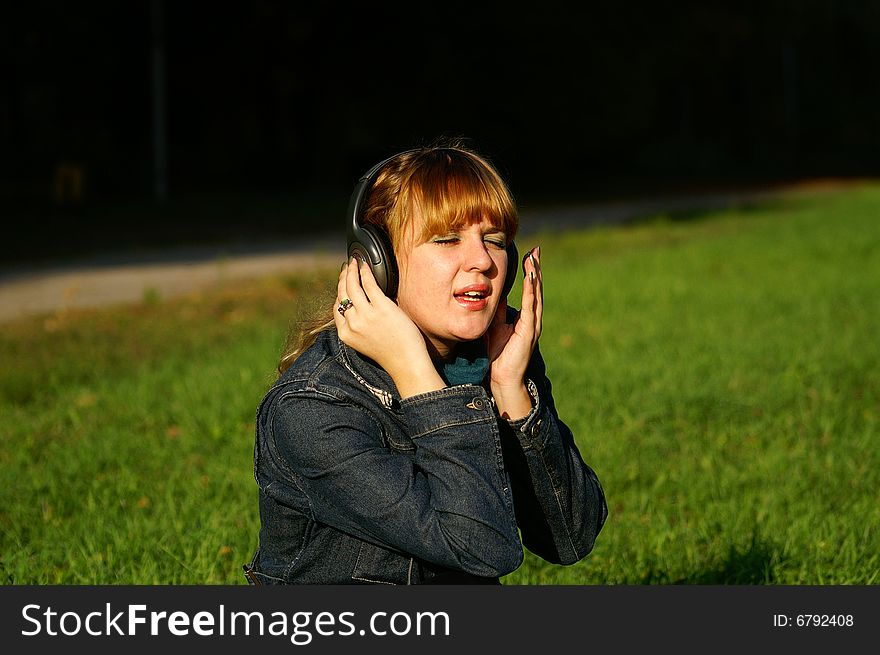 Pretty girl with headphones singing