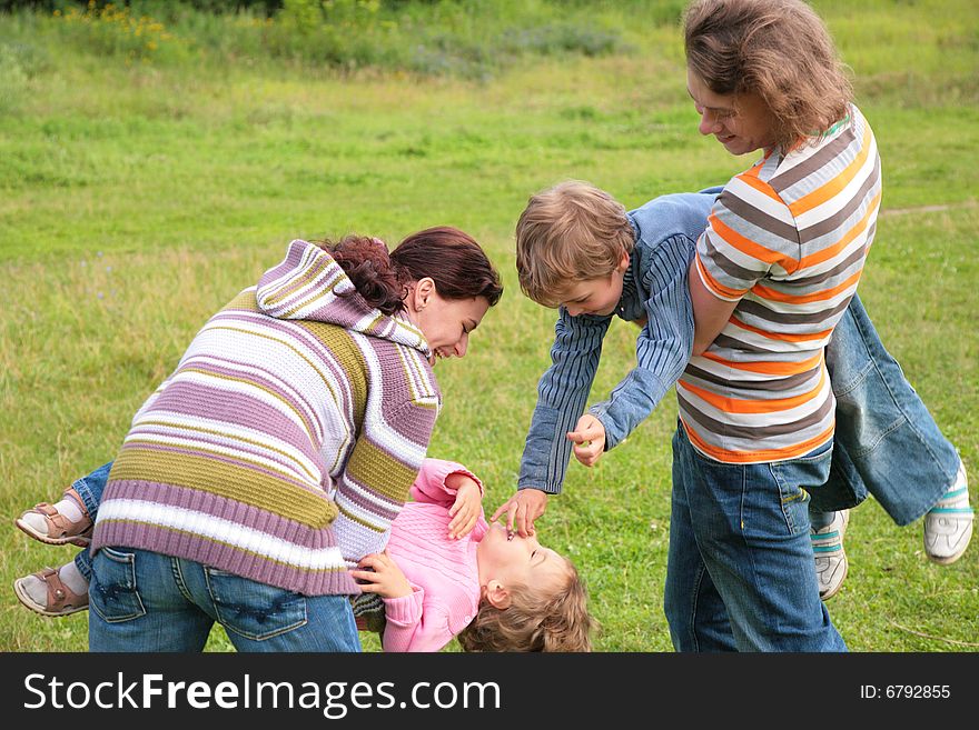 Family With Two Children Plays Outdoor