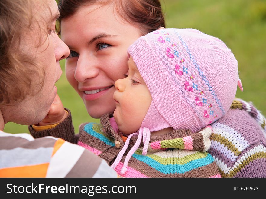 Parents with little child on nature. Parents with little child on nature