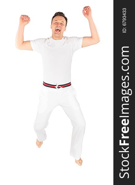 Man in sports suit jumps on white