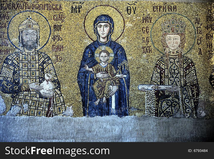 The Comnenus mosaics, equally located on the eastern wall of the southern gallery, date from 1122. The Virgin Mary is standing in the middle, depicted, as usual in Byzantine art, in a dark blue gown. She holds the Child Christ on her lap (wikipedia). The Comnenus mosaics, equally located on the eastern wall of the southern gallery, date from 1122. The Virgin Mary is standing in the middle, depicted, as usual in Byzantine art, in a dark blue gown. She holds the Child Christ on her lap (wikipedia).