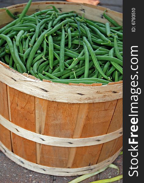 Green beans in a bushel basket at the market. Green beans in a bushel basket at the market.