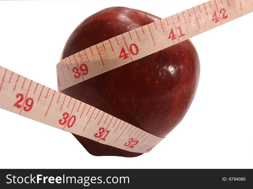 One red apple with measuring tape