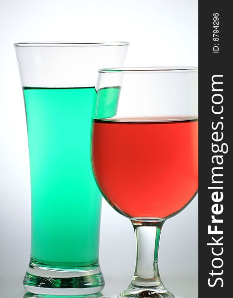 Red Wine with Green Juice on White Background