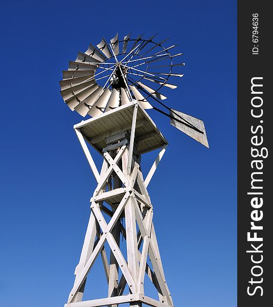 Old windmill over blue sky