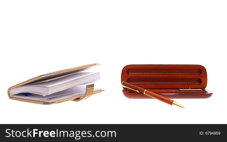 Photo, with a pen and notebook cases for pen on a white background. Photo, with a pen and notebook cases for pen on a white background.