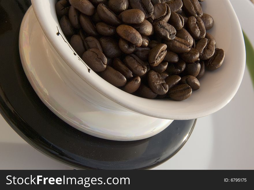 Coffee beans in tea-cup