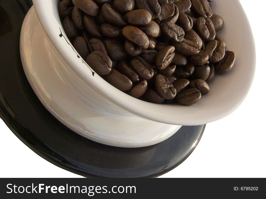 Coffee beans in tea-cup