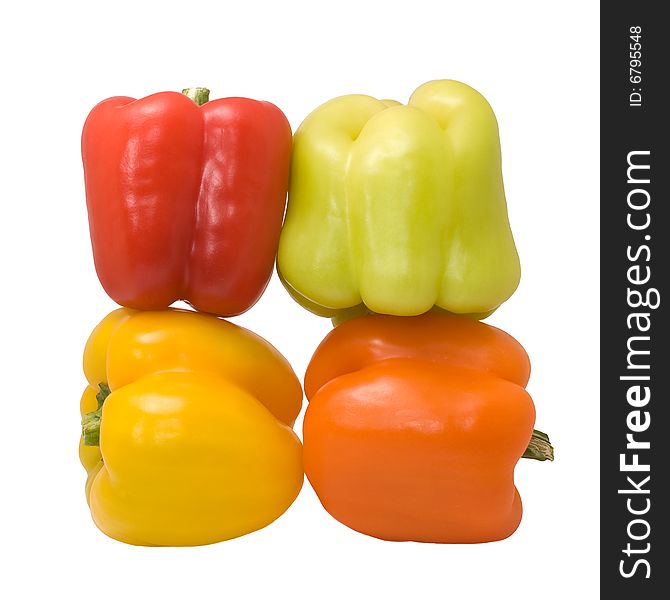 Multicolored peppers isolated on the white background. Multicolored peppers isolated on the white background