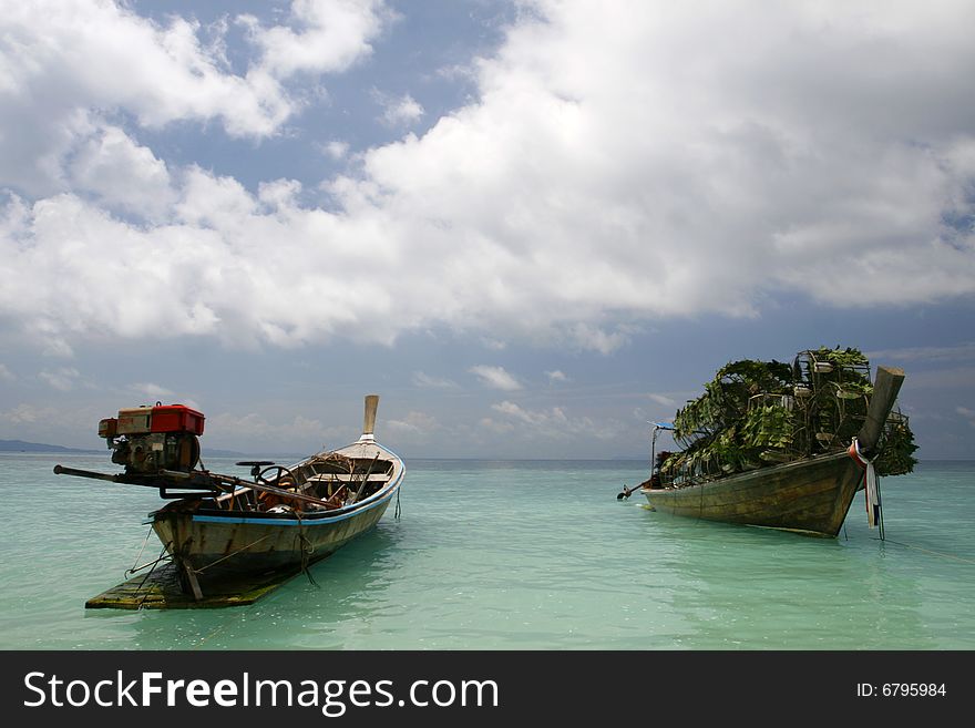 Fishing boats in a small island at Puckett in Thailand. Fishing boats in a small island at Puckett in Thailand