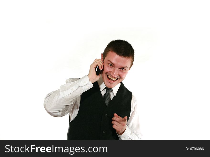 Young man in vest with mobile phone on white. Young man in vest with mobile phone on white