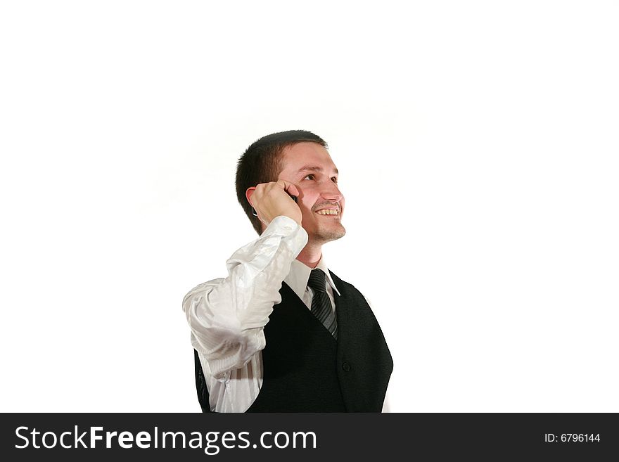 Young man in vest with mobile phone on white. Young man in vest with mobile phone on white