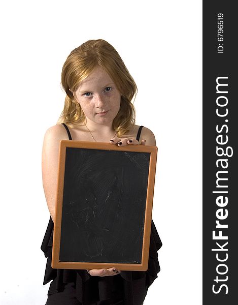 Little girl is holding an empty chalkboard on white