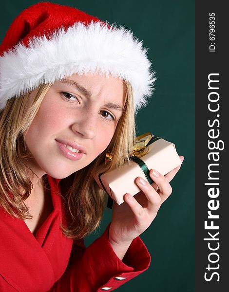 Beautiful teenager wearing a red shirt and christmas hat. Beautiful teenager wearing a red shirt and christmas hat